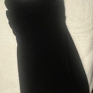 Sleeveless dress with ruffle detail.